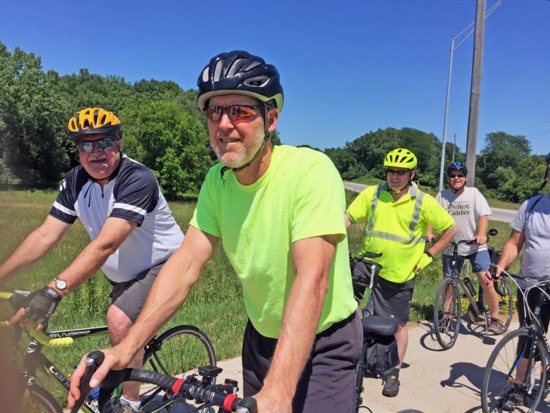 Bishop Thomas Zinkula of Davenport, Iowa, foreground, leads the Bishop's Bike Ride in Iowa City July 6.