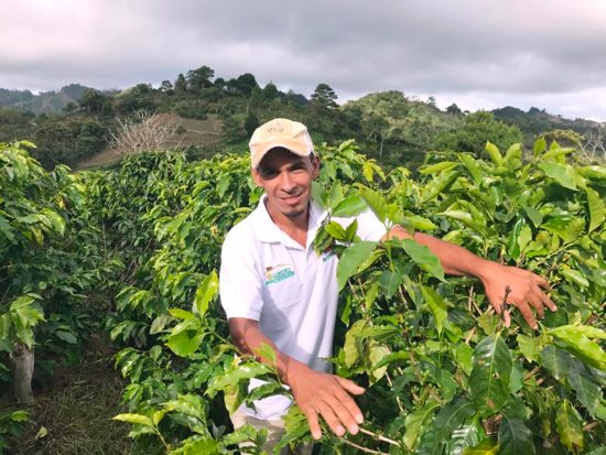 Moises Garc’a poses for a photo on a coffee farm Zapote, Honduras