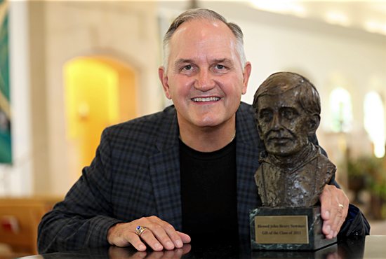 Ron Snyder of Our Lady of Grace in Edina poses with a bust of Cardinal John Henry Newman