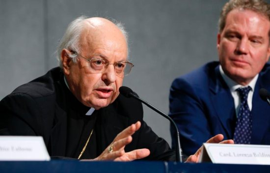 Cardinal Lorenzo Baldisseri, secretary-general of the Synod of Bishops, speaks during a Sept. 18 Vatican news conference to announce synod changes. Also pictured is Greg Burke, Vatican spokesman. Pope Francis has issued an apostolic constitution, updating the rules of how the synod is prepared for, conducted and implemented.