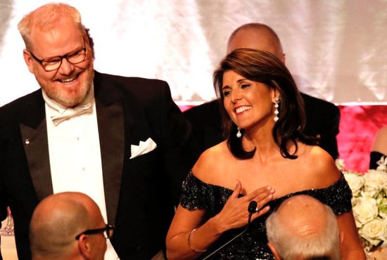U.S. Ambassador to the United Nations Nikki Haley smiles after being introduced by comedian and master of ceremonies Jim Gaffigan, left, during the 73rd annual Alfred E. Smith Memorial Foundation Dinner in New York City Oct. 18. Haley was the charity gala's keynote speaker.