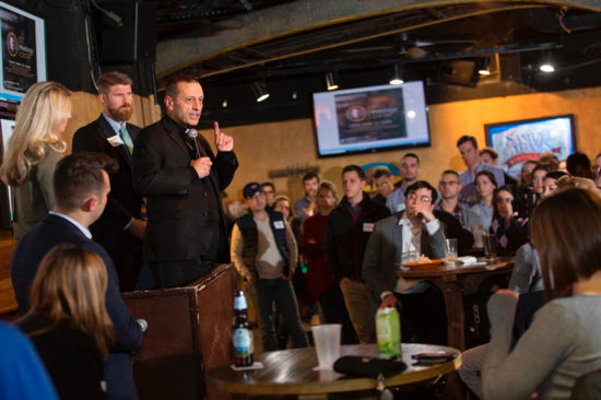 Bishop Frank J. Caggiano of Bridgeport, Conn., speaks Nov. 13 at Theology on Tap with Sarah Yaklic, director of Grotto Network out of the University of Notre Dame, and Jonathan Lewis, assistant secretary for pastoral ministry and social concerns in the Archdiocese of Washington. Bishop Caggiano, who was a delegate at the October Synod of Bishops on young people, spoke Nov. 14 during the bishops' meeting in Baltimore, outlining ways to continue the synod's momentum at the parish and diocesan levels.