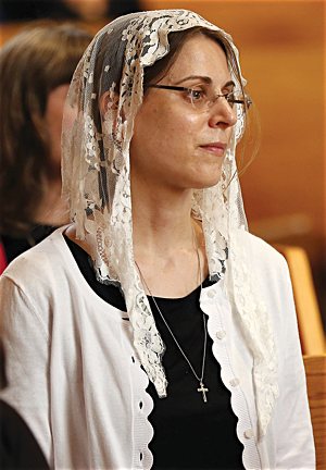 Patty-Jo Mantel, who was consecrated Oct. 7 at St. Agnes in St. Paul, listens during the consecration Mass of Jackie Hintze Sept. 14 at St. Hubert in Chanhassen.