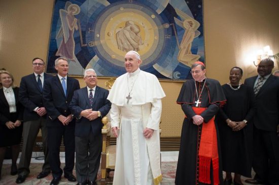 Pope Francis meets with members of the American Bible Society during a private audience at the Vatican