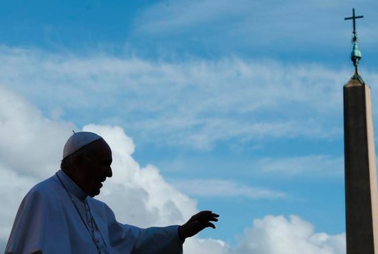 Pope Francis waves as he leaves his general audience in St. Peter's Square 
