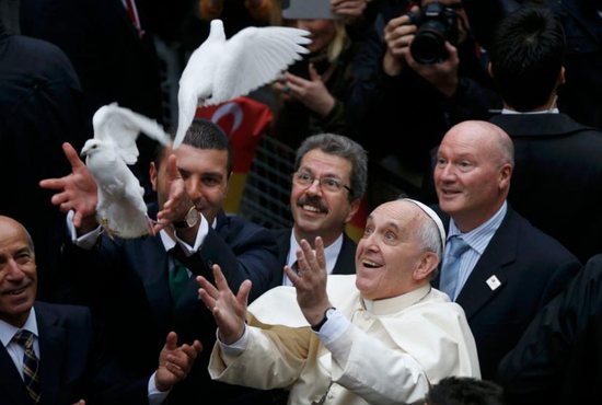 Pope Francis releases doves, a traditional sign of peace, prior to celebrating Mass in 2014 at the Cathedral of the Holy Spirit in Istanbul.