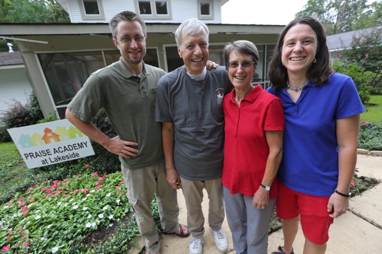 Four members of the Zimmel family stand in front of Praise Academy at Lakeside in Shreveport, La.: David, left, John, Jo and Jeanette.