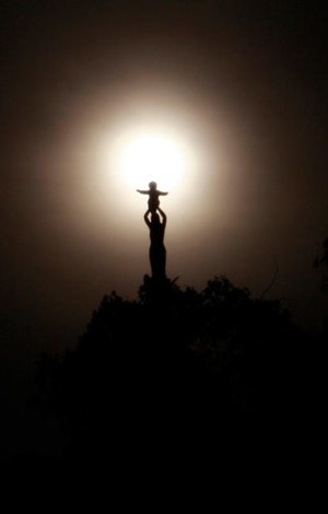 The statue of Our Lady of Sheshan, or Our Lady, Help of Christians, is pictured atop the minor basilica in her name in Shanghai. As part of its ongoing efforts to reconcile China's Catholic communities, the Vatican recognized two previously ex-communicated Chinese bishops as heads of dioceses. 