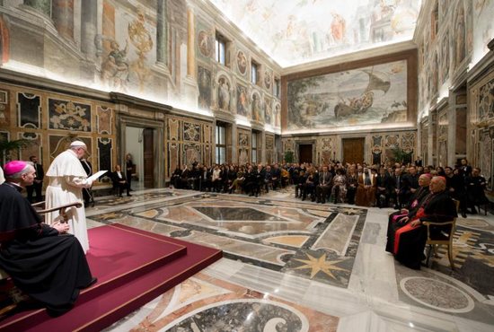 Pope Francis meets Dec. 14 with organizers and artists who will perform in a benefit Christmas concert at the Vatican. The concert proceeds will be donated to two organizations: Scholas Occurrentes in Iraq and the Don Bosco Mission in Uganda