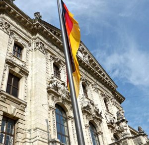 The German flag is seen outside the Ministry of Justice in Munich. German police and prosecutors are launching investigations into clergy sexual abuse following the Sept. 12 leak of a report containing evidence of 3,700 alleged child sex abuse cases in the Catholic Church over a 68-year-period.