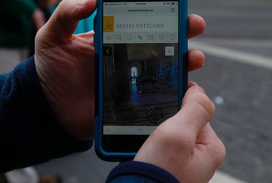 Justin Myers shows what the virtual tours of the Vatican Museums look like on an iPhone Dec. 13. Myers is an intern from Villanova University developing virtual tours of the Vatican Museums.
