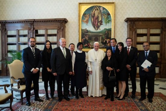 Pope Francis meets with a delegation from the International Commission Against the Death Penalty in the papal library of the apostolic palace Dec. 17.