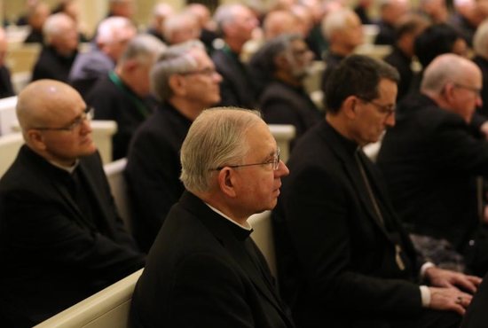 Archbishop Jose H. Gomez of Los Angeles, vice president of the U.S. Conference of Catholic Bishops, center, attends a prayer service in the Chapel of the Immaculate Conception at Mundelein Seminary Jan. 2 at the University of St. Mary of the Lake in Illinois, near Chicago. The U.S. bishops began their Jan. 2-8 retreat at the seminary, suggested by Pope Francis in September, which comes as the bishops work to rebuild trust among the faithful as questions continue to revolve around their handling of clergy sex abuse.