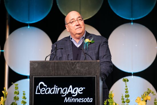 Bill Foussard, a member of the board of Cerenity Senior Care in St. Paul, accepts the Board Trustee of the Year award Feb. 6 from LeadingAge Minnesota at a ceremony at the St. Paul RiverCenter in St. Paul.