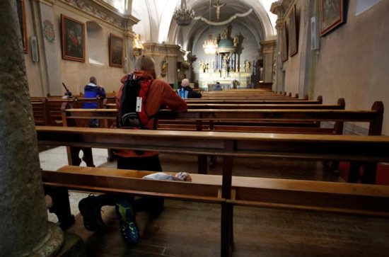 Worshippers pray inside St. Michael Church in Chamonix, France, Aug. 31, 2018. The Observatory on Intolerance and Discrimination against Christians in Europe in Vienna has warned of growing "anti-Christian hostility" in France after identifying assaults on churches and Christian monuments. 