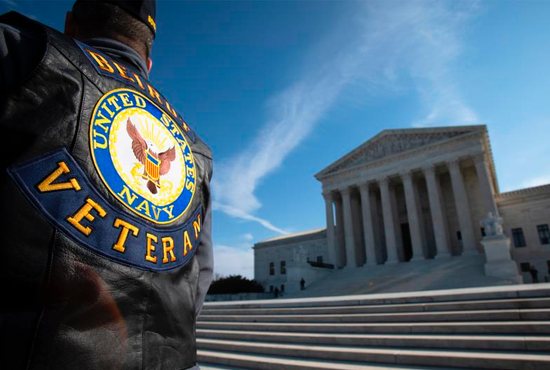 A military veteran is seen near the U.S. Supreme Court in Washington Feb. 27, 2019. Oral arguments were held that day to consider if a 40-foot cross in Bladensburg, Md., endorses religion or is just a secular memorial. The cement and marble cross, which is on a median strip on government property memorializes local soldiers who died in World War I.