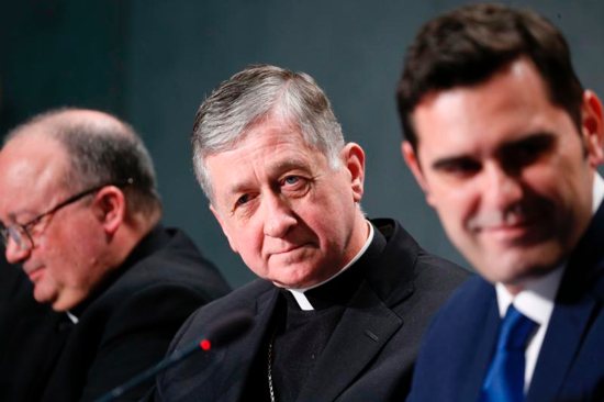 Archbishop Charles J. Scicluna of Malta and Cardinal Blase J. Cupich of Chicago, members of the organizing committee for the Feb. 21-24 Vatican meeting on the protection of minors in the church, attend a press conference to preview the meeting at the Vatican Feb. 18, 2019. Also pictured is Alessandro Gisotti, interim Vatican spokesman.