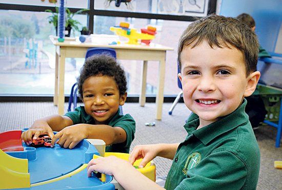 Nolan Pergolski, foreground, and Luke Owusu-Afriyie play cars during “free choice time” Sept. 20 in the preschool classroom at St. Joseph School in Rosemount. 