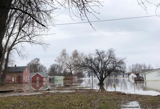 Floodwaters surround homes in Peru, Neb. March 19, 2019. Nebraska Gov. Pete Ricketts and the state's National Guard surveyed flooded farms, homes, bridges and highways, damage Ricketts called "devastating" and perhaps the worst in a half-century. At least three people have been reported killed. 