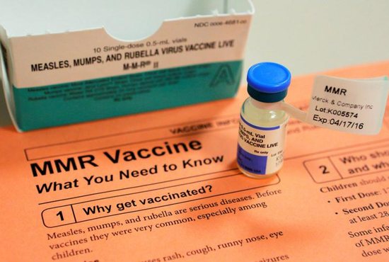 A vial of measles, mumps and rubella vaccine and an information sheet is seen at Boston Children's Hospital Feb. 26, 2015. Catholic parents should vaccinate their children for the good of their children and the community, and they can do so with a "clear conscience" that "the use of such vaccines does not signify some sort of cooperation in voluntary abortion," said the Pontifical Academy for Life. 