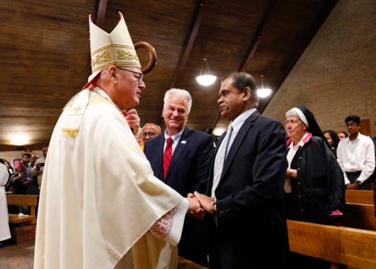 New York Cardinal Timothy M. Dolan greets Amrith Rohan Perera, Sri Lanka's permanent representative to the United Nations, at the beginning of Mass May 12, 2019, at St. Adalbert Church in the Staten Island borough of New York. Cardinal Dolan celebrated the liturgy for the repose of the souls of the more than 250 people killed in the Easter suicide bombings in Sri Lanka. The cardinal also led prayers to end the persecution of Christians throughout the world.