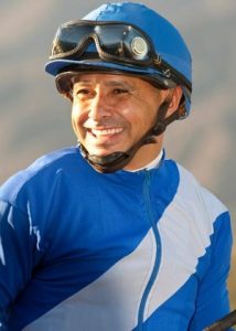 Jockey Mike Smith celebrates after winning the Grade I, $250,000 Santa Anita Sprint Championship aboard Points Offthebench, Oct. 5, 2013, at Santa Anita Park in Arcadia Calif.