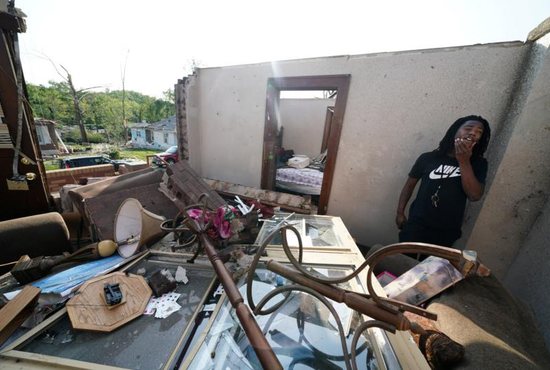 Armonn Cody stands in his destroyed home May 23, 2019, following a tornado in Jefferson City, Mo. An outbreak of strong storms the evening of May 22 spawned tornadoes that razed homes, flattened trees and tossed cars across a dealership lot, injuring about two dozen people in Missouri's capital city and killing at least three others elsewhere in the state.