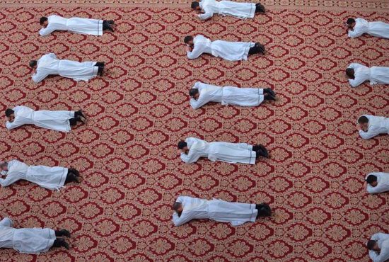 Candidates for the priesthood lie prostrate during an ordination Mass celebrated by Pope Francis in St Peter's Basilica at the Vatican May 12, 2019. The pope ordained 19 new priests.
