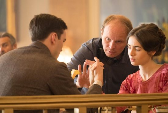 Nicholas Hoult, director Dome Karukoski and Lily Collins are seen on the set of the movie "Tolkien." 