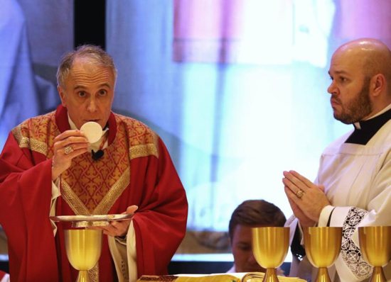 Cardinal Daniel N. DiNardo of Galveston-Houston, president of the U.S. Conference of Catholic Bishops, concelebrates Mass at the spring general assembly of the USCCB in Baltimore June 11, 2019.