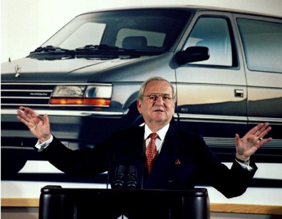Former Chrysler CEO Lee Iacocca pictured in front of a minivan