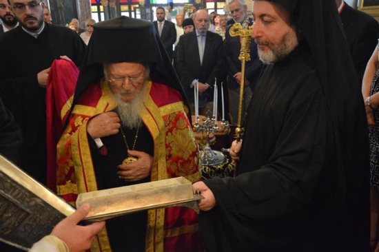 Ecumenical Patriarch Bartholomew of Constantinople prays before a reliquary containing bone shards