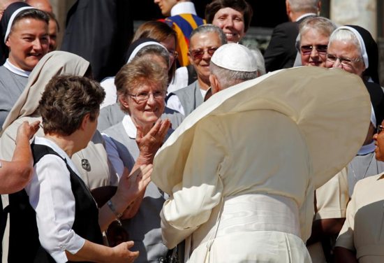 Pope Francis greets pilgrims during his general audience