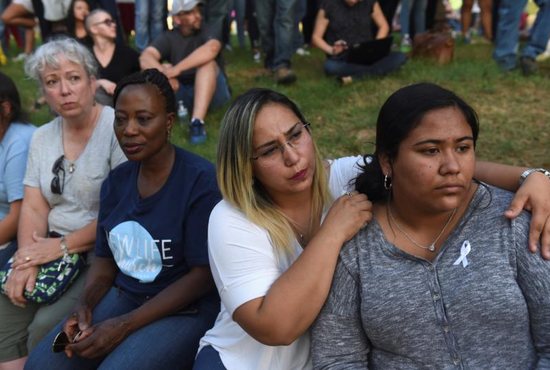 People gather for a vigil