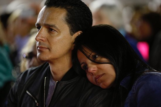 A couple attend a prayer vigil for the Synod of Bishops on the family in St. Peter's Square at the Vatican in this Oct. 3, 2015, file photo. The "Amoris Laetitia" Family Year, which opened March 19, is an opportunity for Catholics to read Pope Francis' 2016 document and discover its reflections on family life.