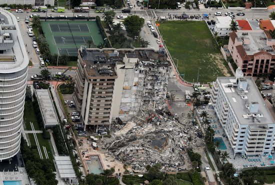 An aerial view shows a partially collapsed building in Surfside, Fla., just north of Miami Beach, June 24, 2021. 
