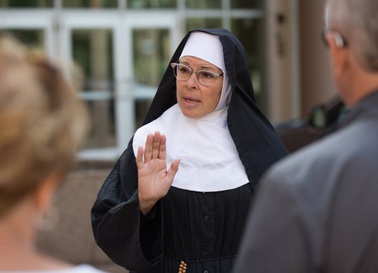 Actress Michelle Berg as Sister Celeste talks about the history of St. Paul during a tour July 8. DAVE HRBACEK | THE CATHOLIC SPIRIT