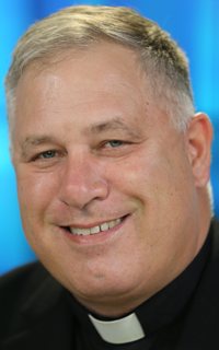 Msgr. Jeffrey D. Burrill, a priest of the Diocese of La Crosse, Wis., is pictured at the USCCB headquarters in Washington Nov. 17, 2020, during the bishops' virtual fall meeting. Msgr. Burrill resigned as USCCB general secretary July 20, 2021, amid "impending media reports alleging possible improper behavior." In announcing the resignation, Archbishop José H. Gomez of Los Angeles, USCCB president, said the claim "did not include allegations of misconduct with minors."
