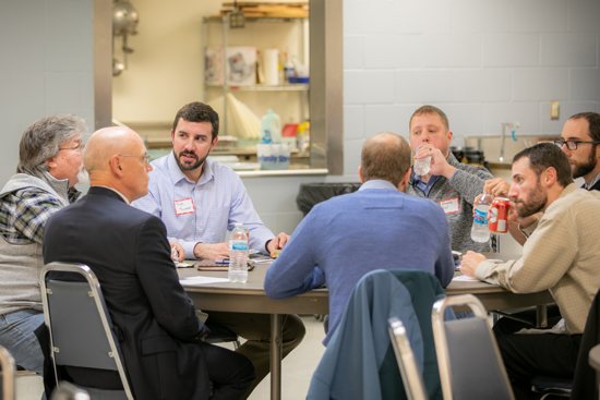 Seven members of the St. Joseph Business Guild network at the inaugural meeting Oct. 22, 2019, before dinner and a presentation by guild chaplain, Father Byron Hagan. Fifty-five members attended the first meeting.