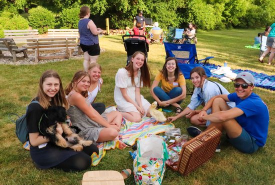 Young people were among those gathered at an all-parish picnic at Holy Name of Jesus in Medina in June. The parish also offered food trucks on its grounds one day in July as a way to build community. 