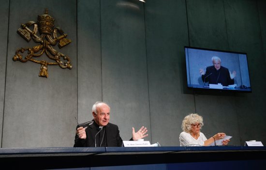 Archbishop Vincenzo Paglia, president of the Pontifical Academy for Life, speaks at a news conference at the Vatican Sept. 28, 2021. He spoke to journalists about the challenges amid the pandemic, including health care inequality and vaccine hesitancy. Also pictured is Cristiane Murray, vice director of the Vatican Press Office.