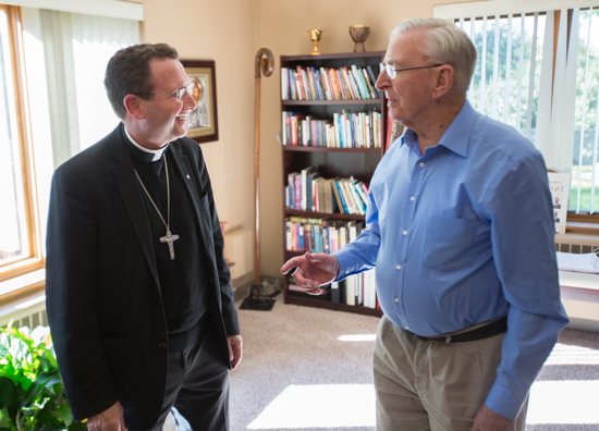 Bishop-designate Cozzens, left, speaks Oct. 18 with Bishop Emeritus Victor Balke, who led the Crookston diocese from 1976–2007, at the Sacred Heart rectory in East Grand Forks, where Bishop Balke lives.