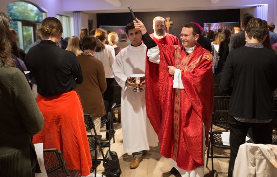 Bishop Andrew Cozzens blesses the faithful at the new St. Paul’s Outreach building in Mendota Heights during Mass and dedication Oct. 14.