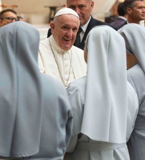 Pope Francis greets a group of nuns as he arrives for his general audience in Paul VI hall at the Vatican Aug. 21, 2019. Women religious have an essential role in the process of creating a more synodal church in preparations for the Synod of Bishops, Pope Francis said during an Oct. 11, 2021, meeting at the Vatican with the general chapter of the Sisters of Charity of St. Jeanne-Antide Thouret.