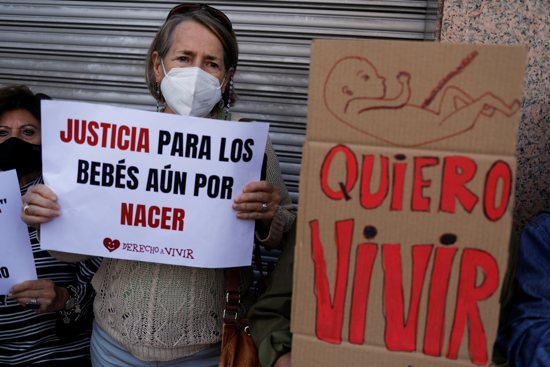 Supporters of anti-abortion organizations protest outside the Constitutional Court in Madrid Sept. 28, 2021. The banners read "Justice for unborn babies" and "I want to live."