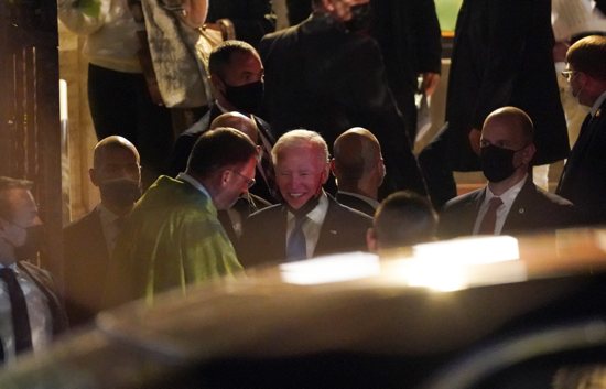 U.S. President Joe Biden speaks with Paulist Father Steven J. Petroff after attending a Saturday evening Mass at St. Patrick's Church during a break in the G-20 summit in Rome Oct. 30, 2021.