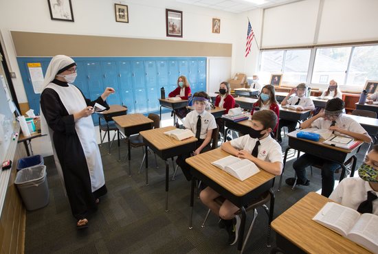 Sister Mary Pieta of the Handmaids of the Heart of Jesus teaches seventh graders Oct. 29 at Holy Family Academy in St. Louis Park.