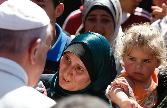 Pope Francis meets refugees at the Moria refugee camp on the island of Lesbos, Greece, in this April 16, 2016, file photo. Pope Francis will visit Greece again Dec. 4-6, 2021.