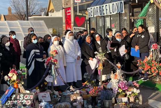 Religious sisters from several Latin American countries pray at George Floyd Square in Minneapolis Nov. 15 on their way to Winona for a week of activities at St. Mary’s University of Minnesota. Enrolled in degree programs in health and human services via distance learning, the 38 sisters who visited the site also serve as missionaries in impoverished Latino communities across the U.S.