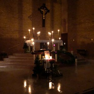 Candlelight illuminates the altar before last year’s Rorate Mass at Our Lady of Peace in Minneapolis. This year’s Mass will be celebrated 7:15 a.m. Dec. 11. 
